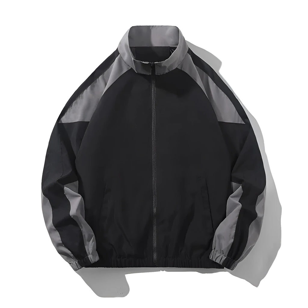 Men's black and dark blue colour block casual jacket with contrast stitching and side pockets.