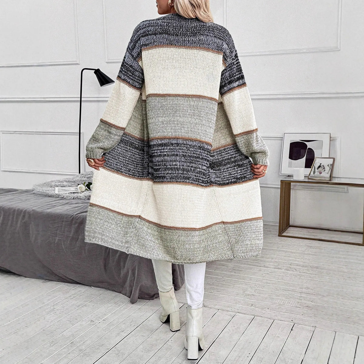 Gray women's knitted long cardigan with loose fit and long sleeves.