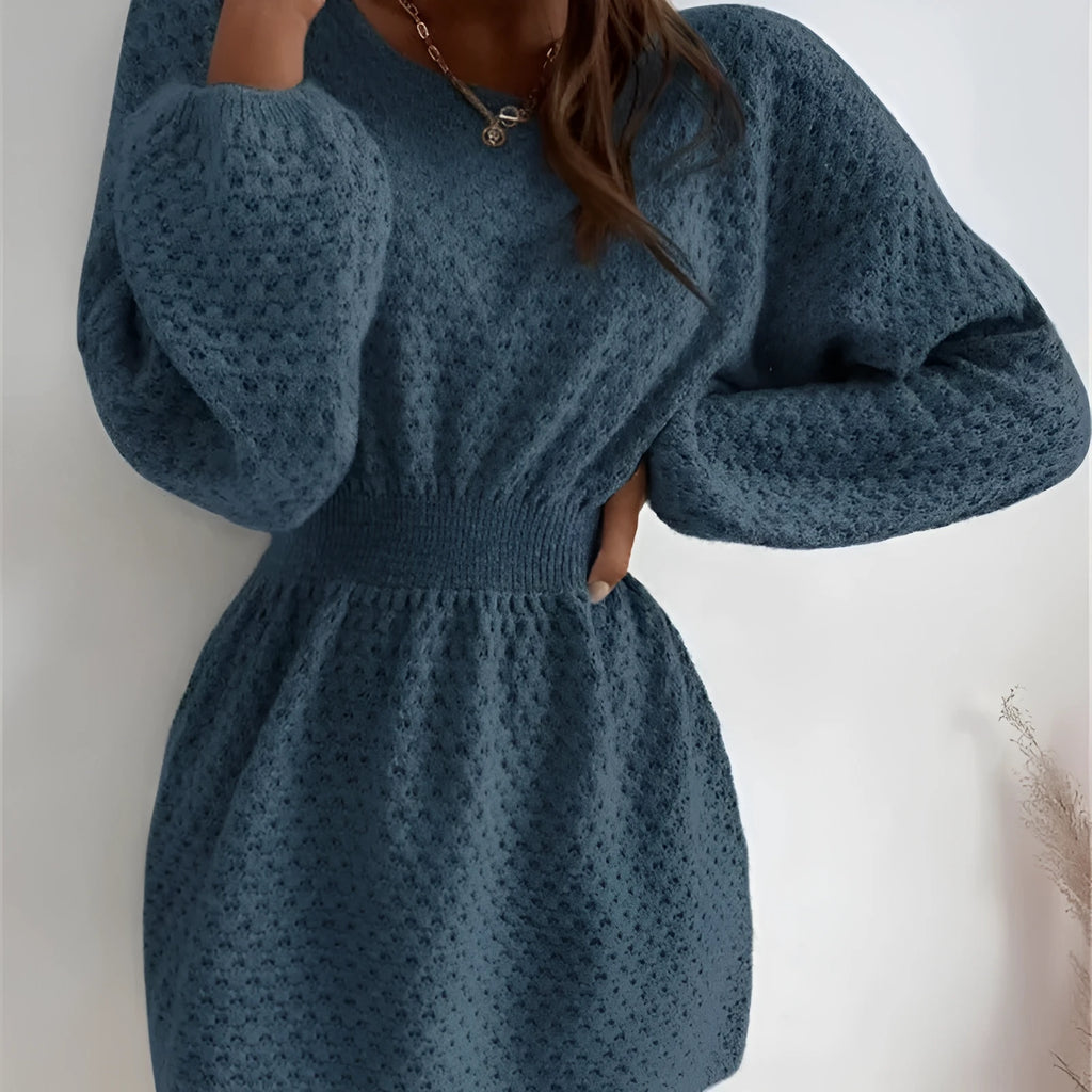 Blue women's knitted dress with crocheted flower details and fitted waist design