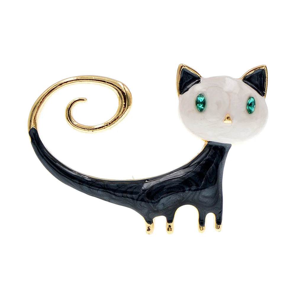White and orange painted trailing up kitty brooch made from alloy metal