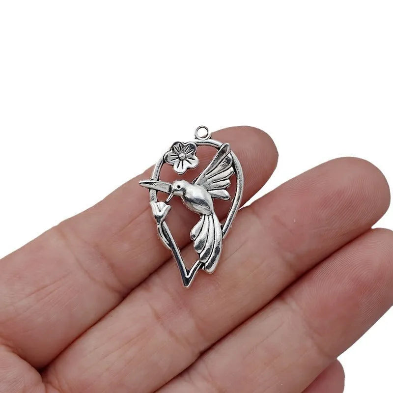 Silver-coloured magpie bird charm pendant for DIY jewellery making