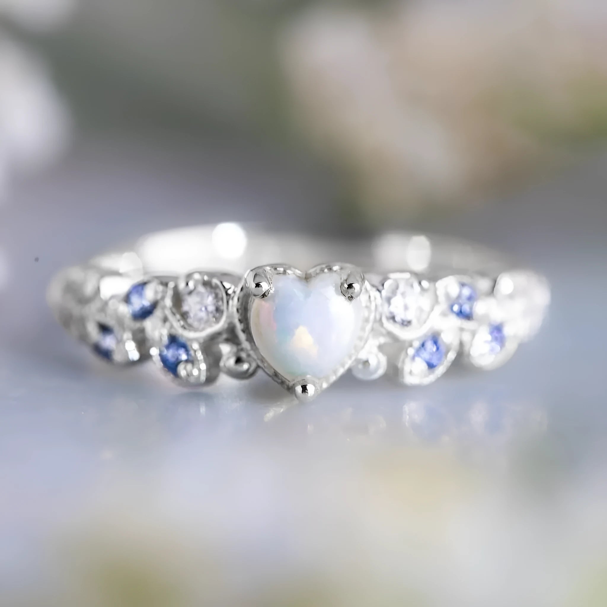 Peach-coloured heart-shaped women's ring with flower and opal ocean design on alloy metal