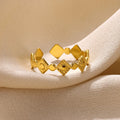 Gold diamond coloured titanium steel geometric women's ring on a free size band.