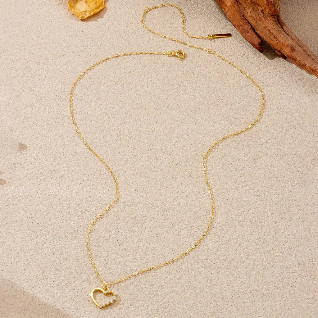 S925 sterling silver hollow heart and circle pendant necklace on a regular chain, shown in two colour finishes.