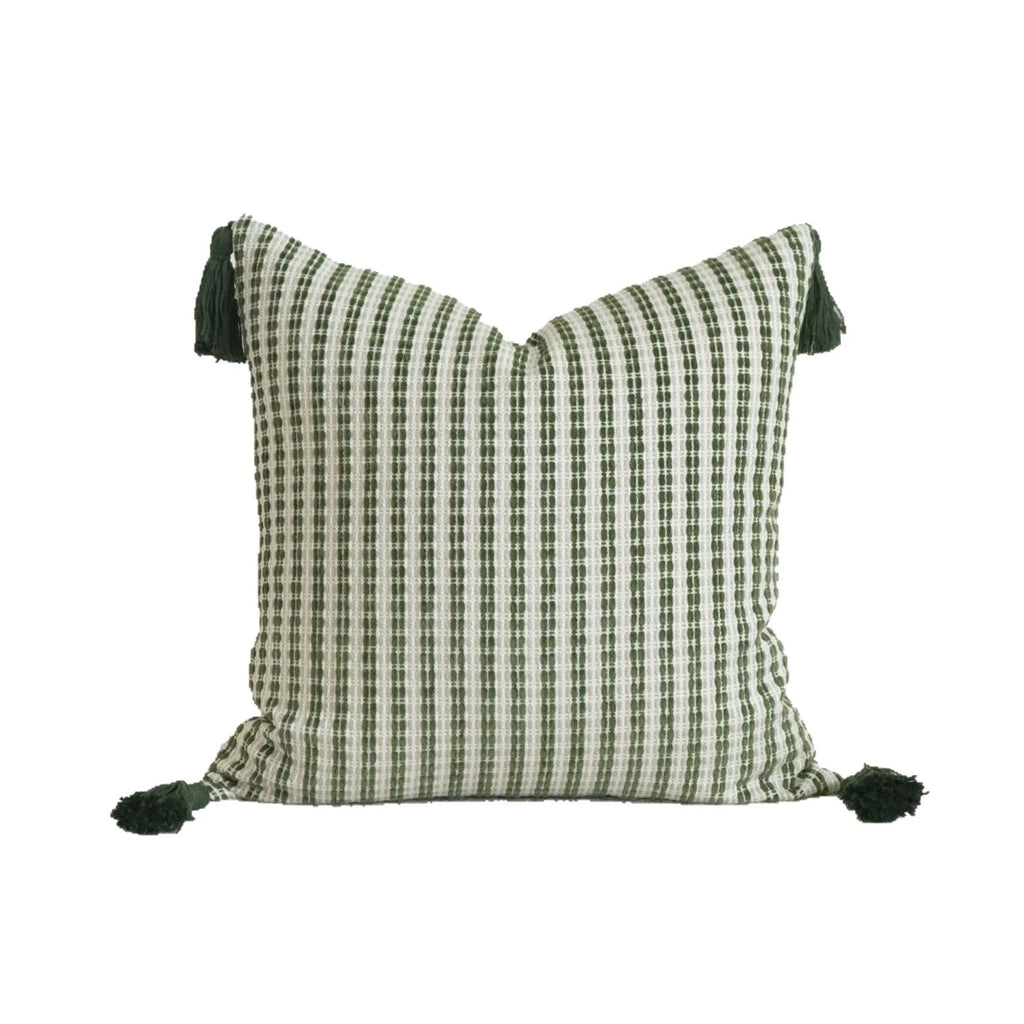 Green patterned cotton linen decorative pillow on a bed, shown in striped, botanical, and leaf designs.