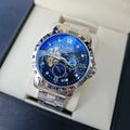 Men's silver automatic mechanical watch with black starry dial and luminous hands on steel strap