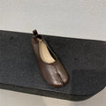 Women's apricot chunky heel pumps with a split toe horseshoe peas design and round toe.