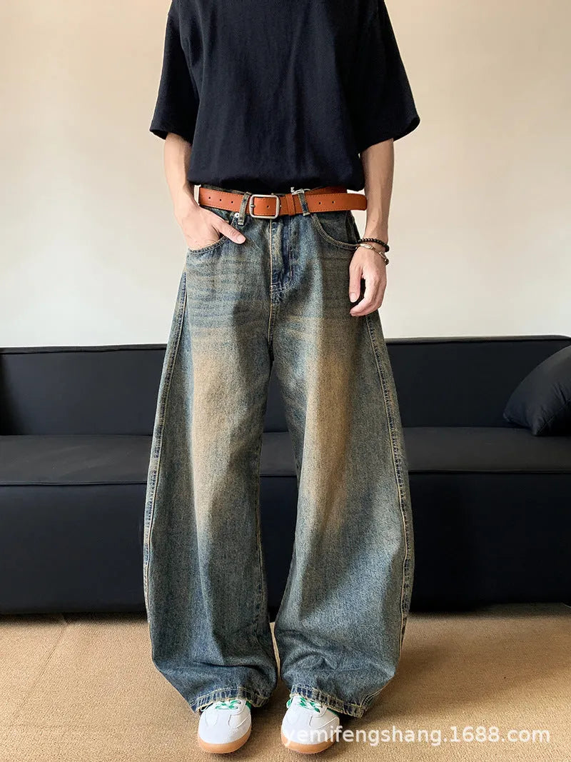 Men's retro blue distressed denim jeans with wide-leg trouser design and micro-elastic fabric