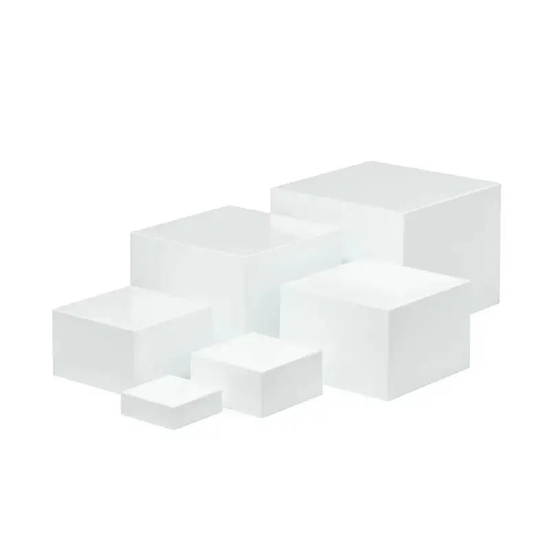 White plastic 6-piece interlocking cube dessert display stand showing tiered arrangement.