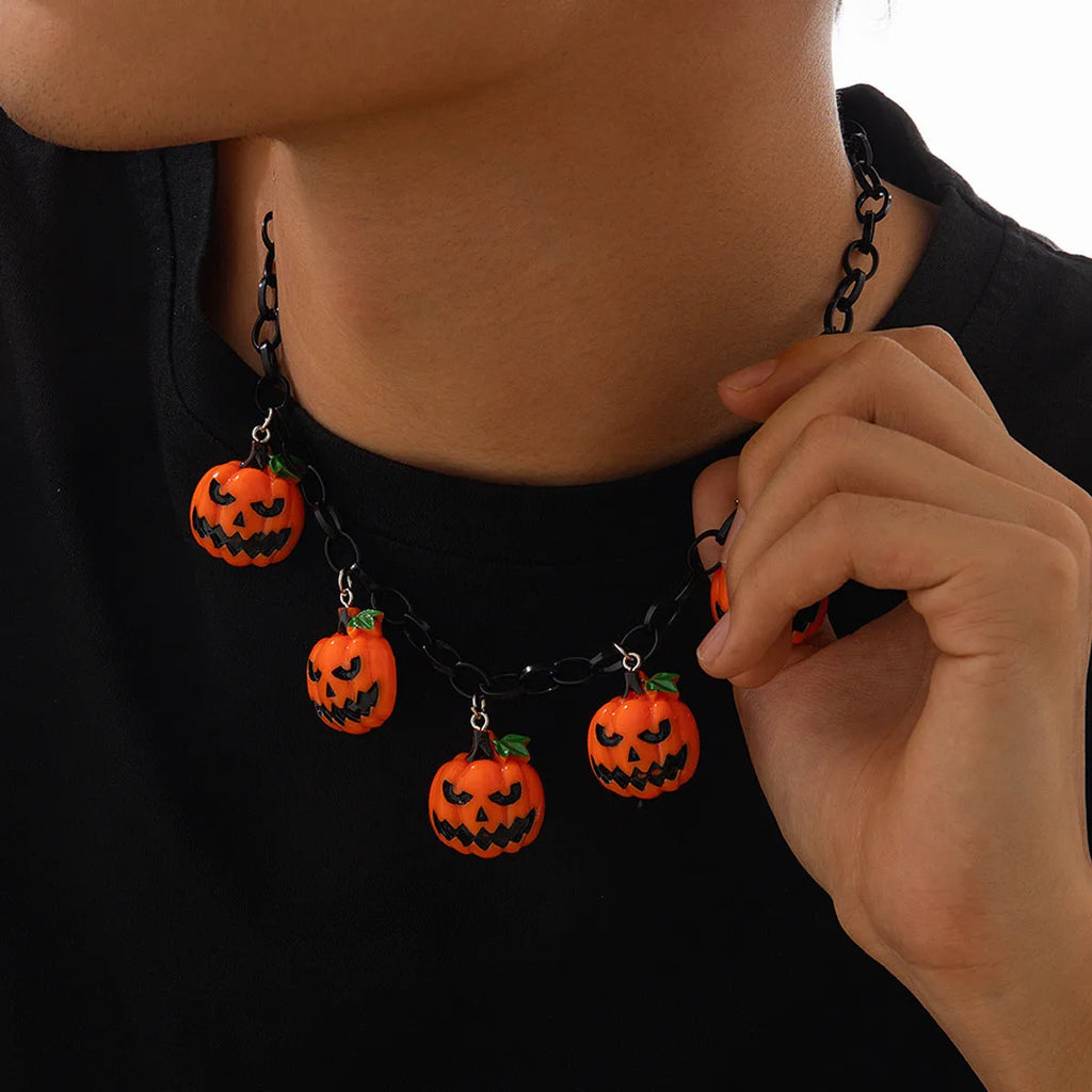 Mixed colour cartoon ghost and pumpkin acrylic pendant on a chain for Halloween.