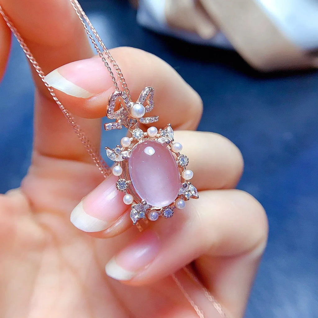 Geometric silver pendant with pink rose quartz crystal and rose gold plating on alloy chain