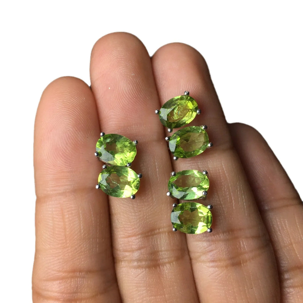 Pair of natural grass green olivine stud earrings with elliptical 6 × 8mm stones in S925 sterling silver settings