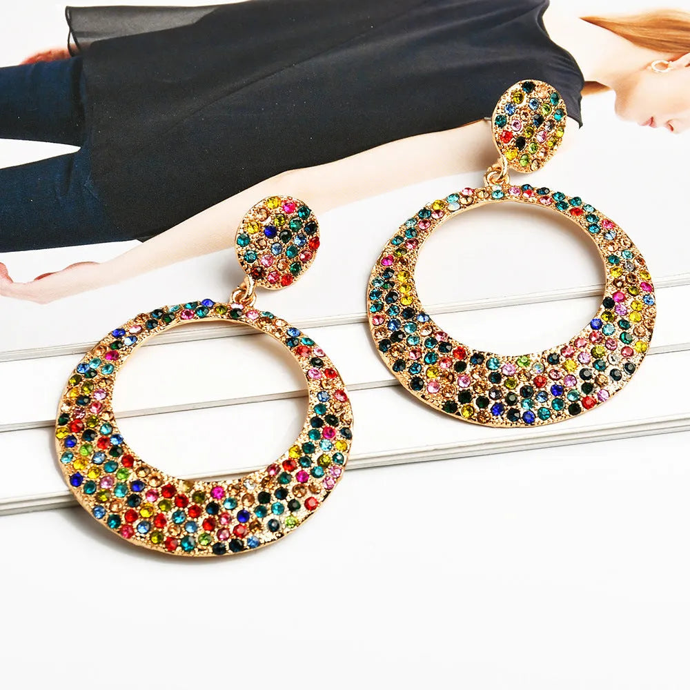 Alloy cartoon pendant earrings with large round coloured pendants and post backs for pierced ears