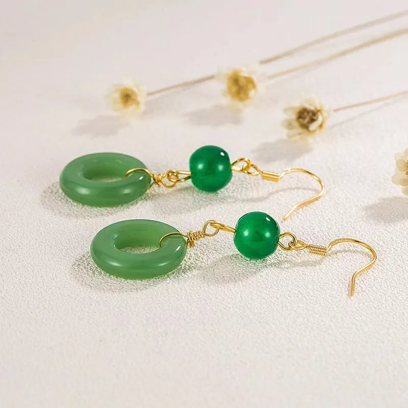 Green Chinese style peace buckle shaped earrings with geometric design and gold plating