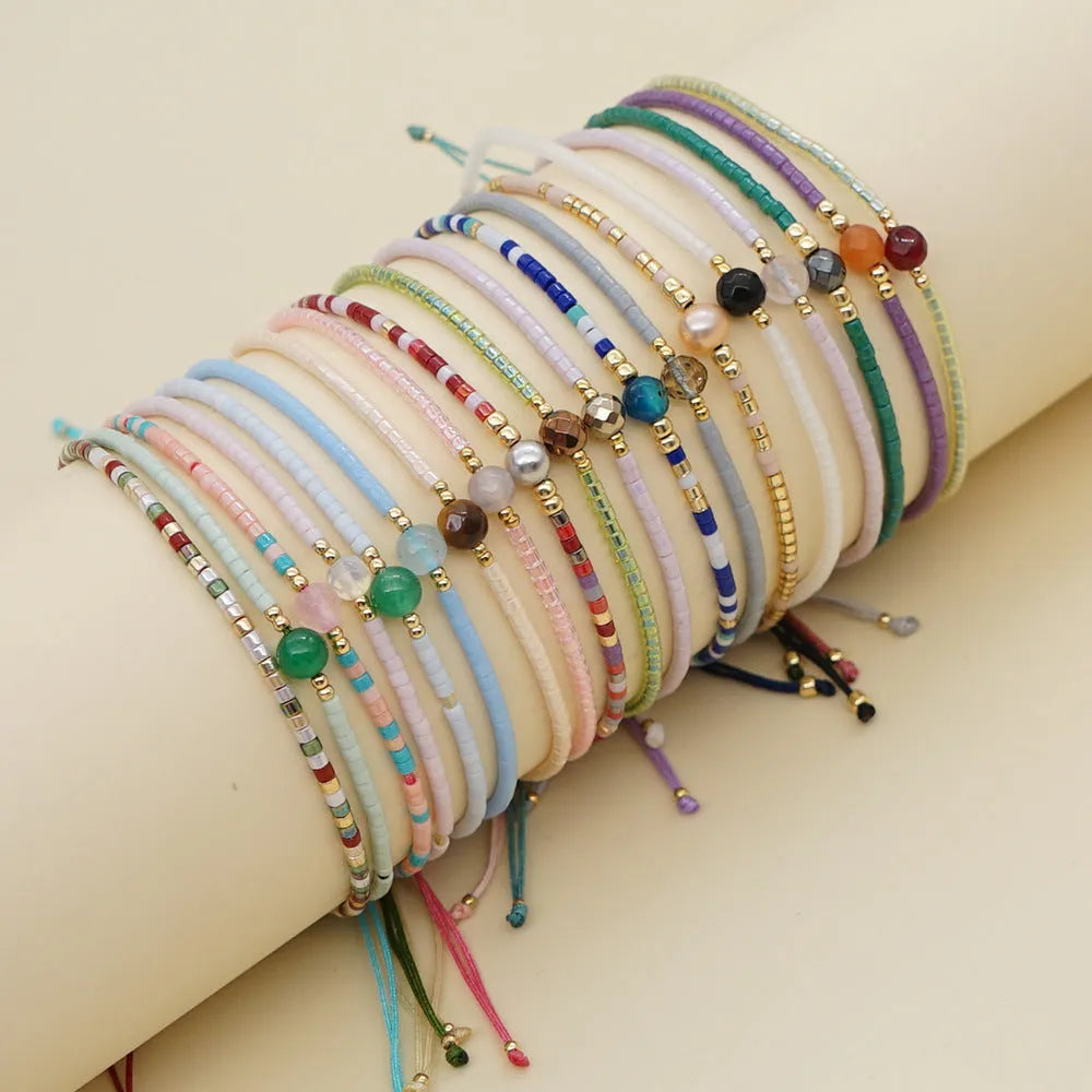 Women's colourful beaded bracelet with geometric glass beads in bohemian style