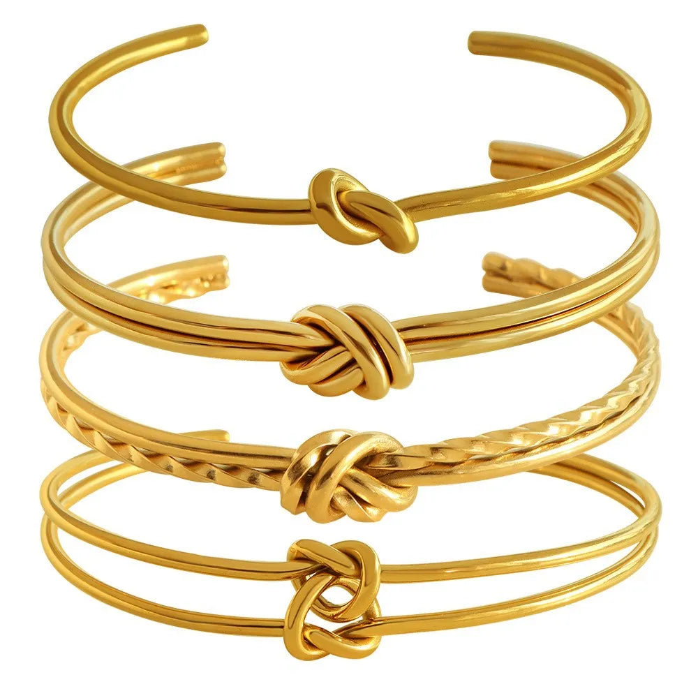 Women's adjustable stainless steel bracelet with C-shaped open design, double-layer construction and knotted detailing in gold or silver finish