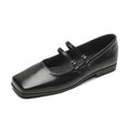 Silver women's leather ballet flats with a cross buckle strap and round toe.