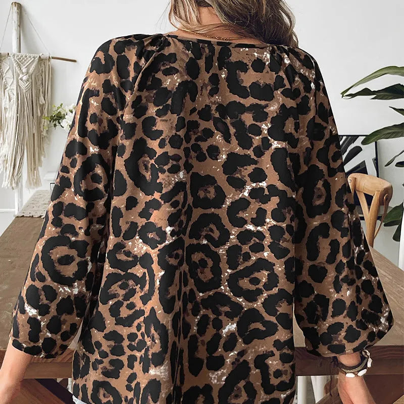 Women's leopard print V-neck pullover top with half sleeves and pleating detail