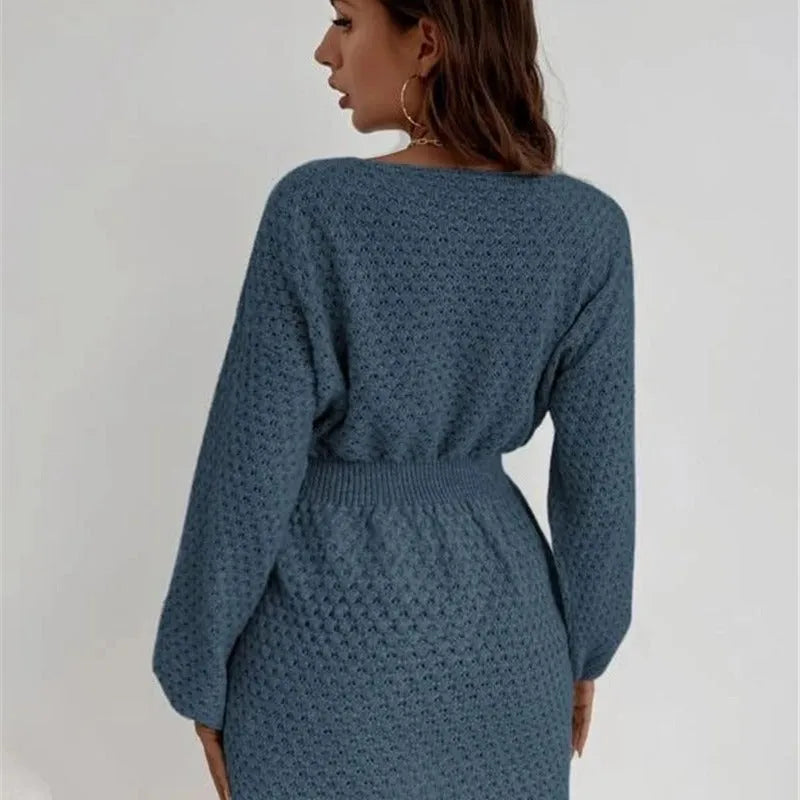 Blue women's knitted dress with crocheted flower details and fitted waist design