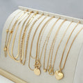 Gold electroplated women's necklace set with 10 jewellery ornaments on snake bone chain