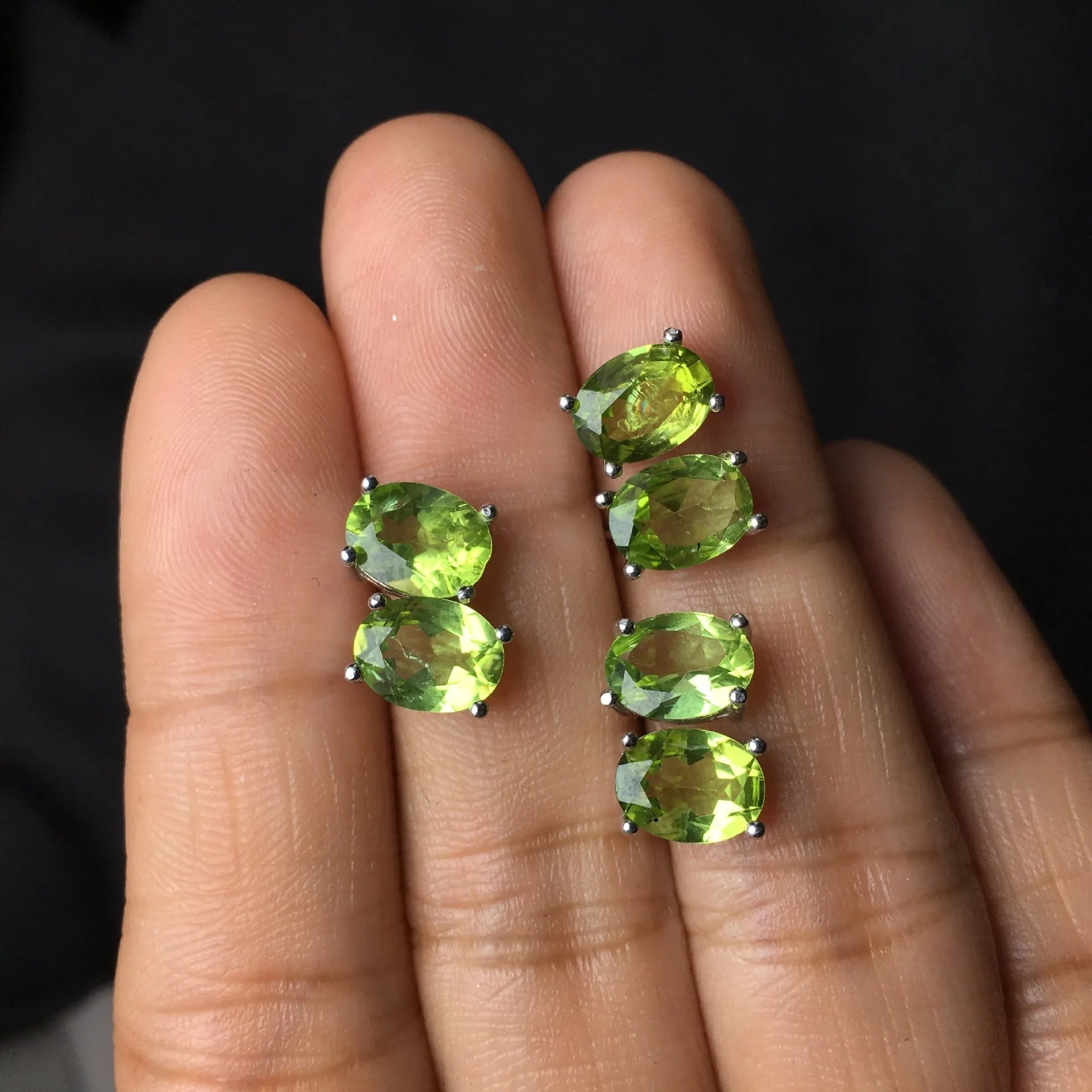 Pair of natural grass green olivine stud earrings with elliptical 6 × 8mm stones in S925 sterling silver settings