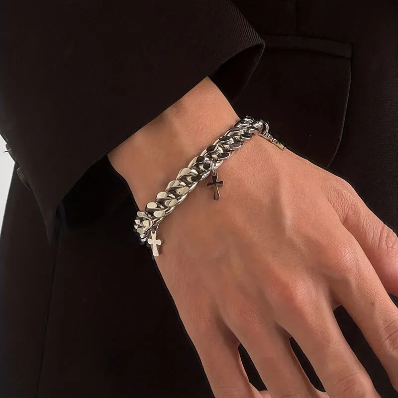 Men's titanium steel bracelet with a cross design and geometric shape on a wrist.