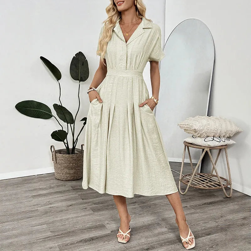 Light green lapel shirt dress with a waist tie and skirt pockets on a model.