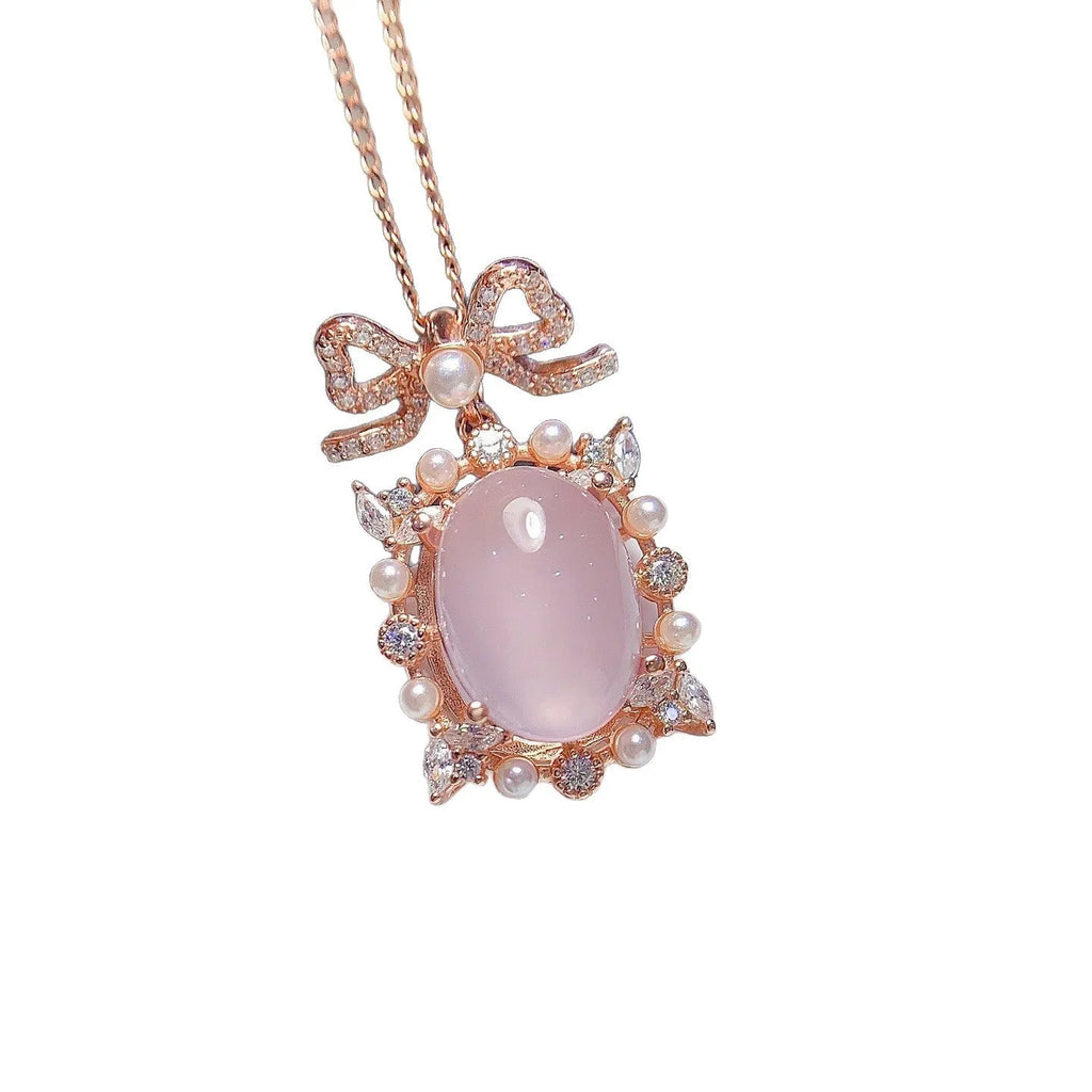 Geometric silver pendant with pink rose quartz crystal and rose gold plating on alloy chain