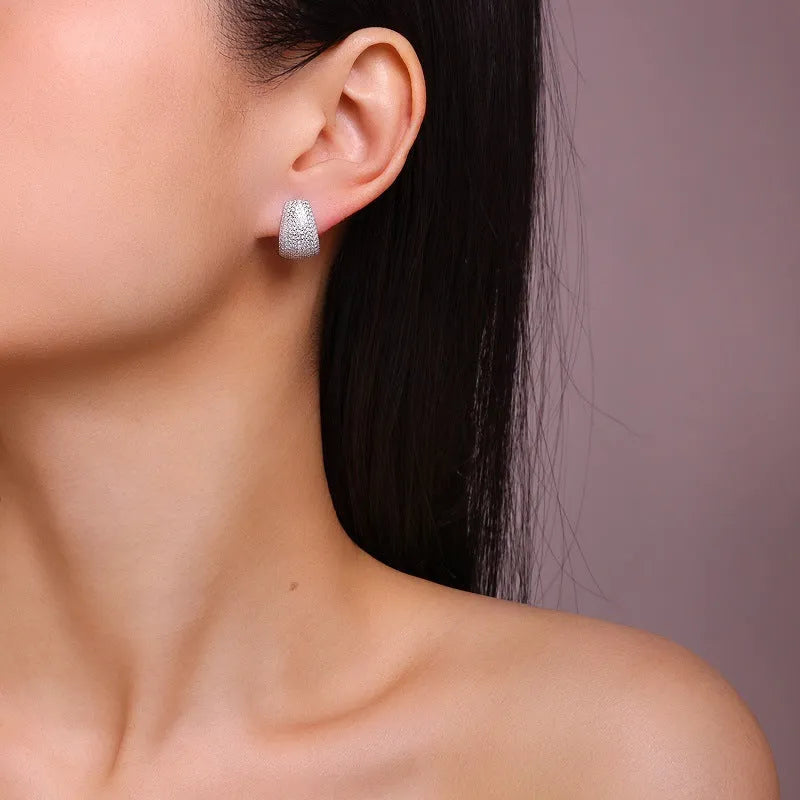 Sterling silver geometric stud earrings with moissanite stones for everyday wear