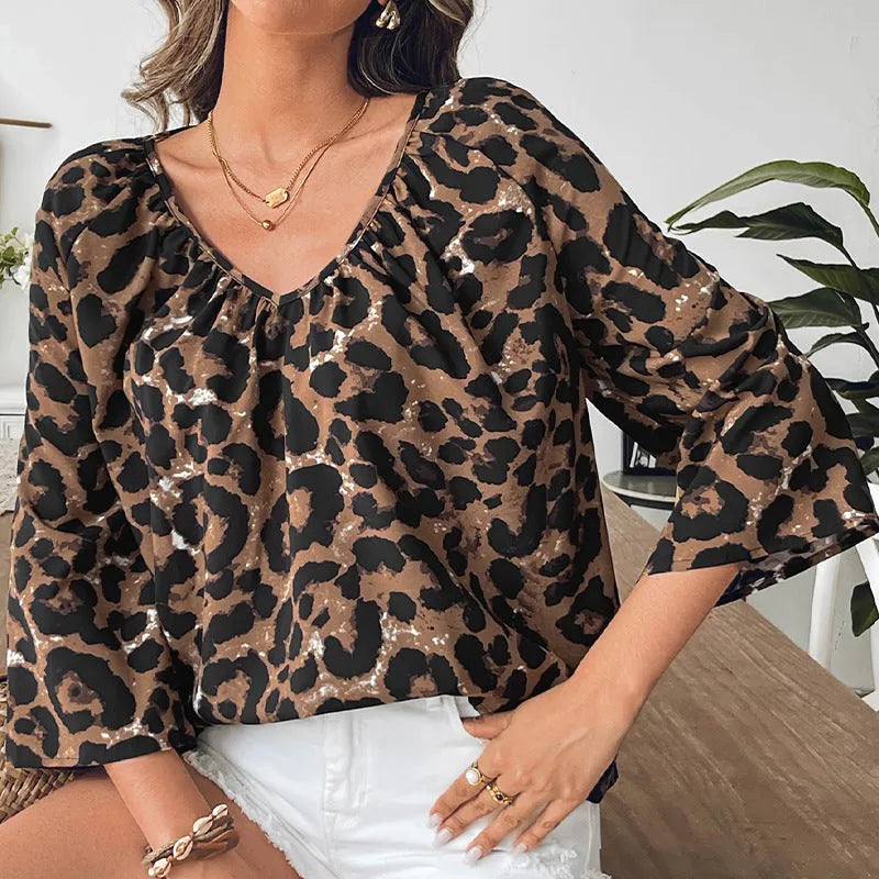 Women's leopard print V-neck pullover top with half sleeves and pleating detail