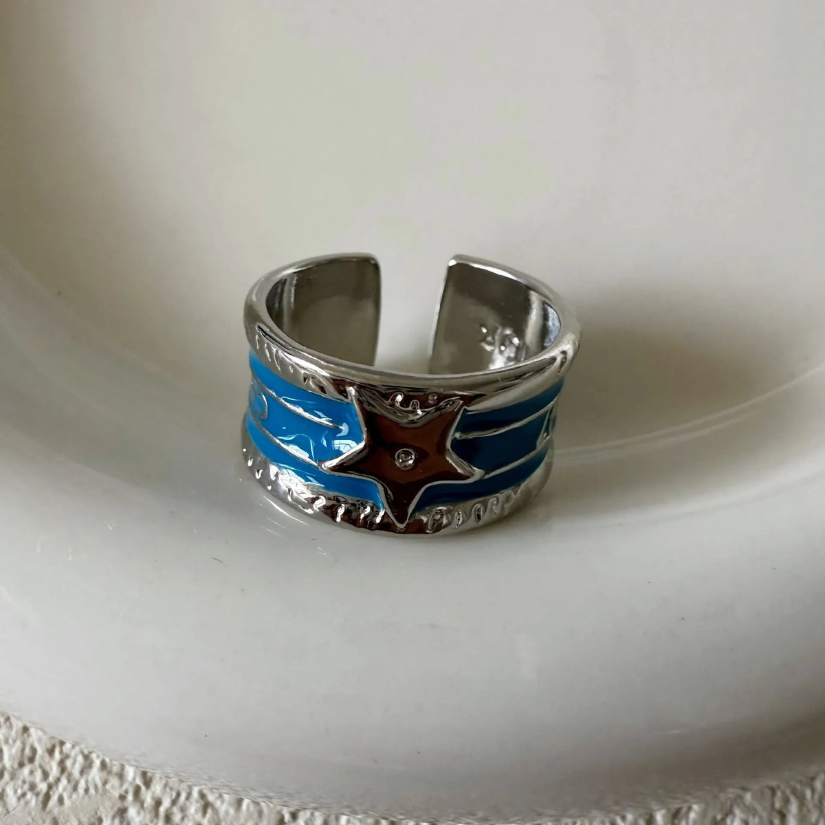 Adjustable geometric drop oil ring for women in distressed copper, shown in multiple colour options.