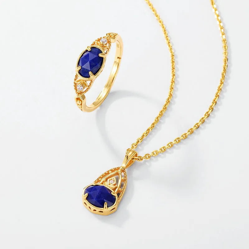 Oval geometric women's ring with a blue lapis lazuli stone in a silver alloy Japanese-style setting.