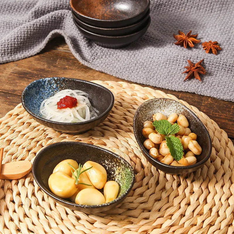 Japanese ceramic oval sauce dipping bowl with decorative glaze pattern
