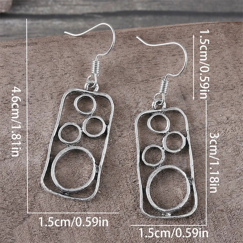 Geometric earrings with round ring and irregular square design in antique silver colour