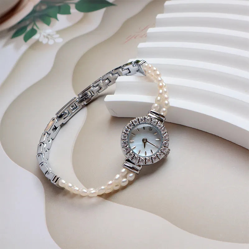Light gold women's freshwater pearl bracelet watch with stainless steel strap and round mineral glass dial