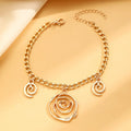 Gold or silver electroplated alloy jewellery set with spiral donut geometric shapes including necklace bracelet and ear hooks