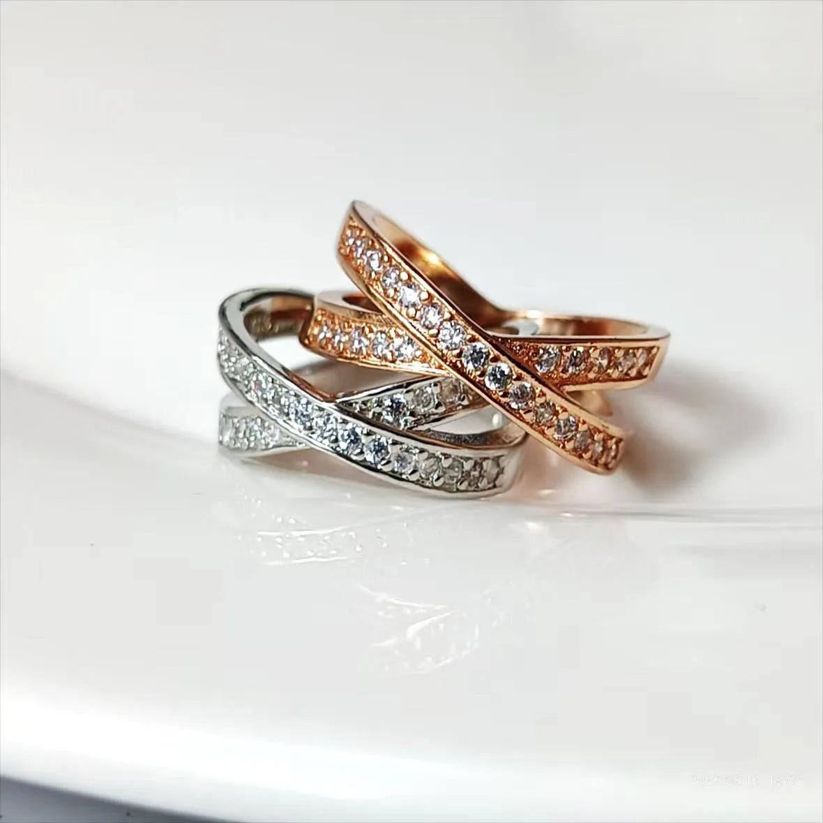 Metal cross ring with micro-inlaid zircon detailing in silver or rose gold plating