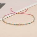 Women's colourful beaded bracelet with geometric glass beads in bohemian style