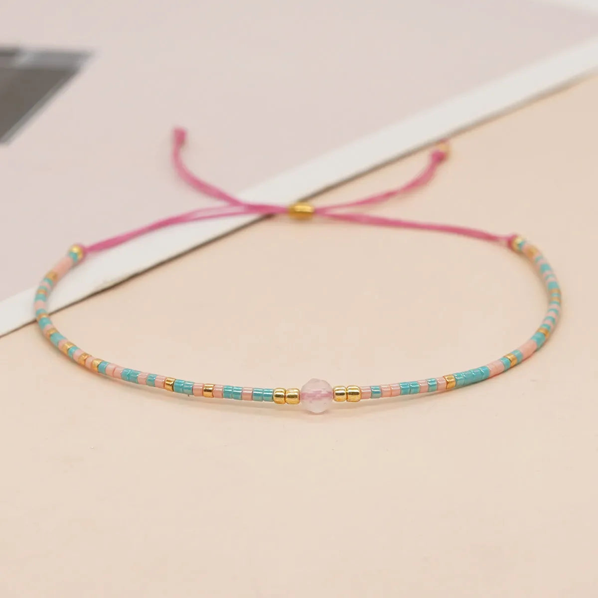 Women's colourful beaded bracelet with geometric glass beads in bohemian style