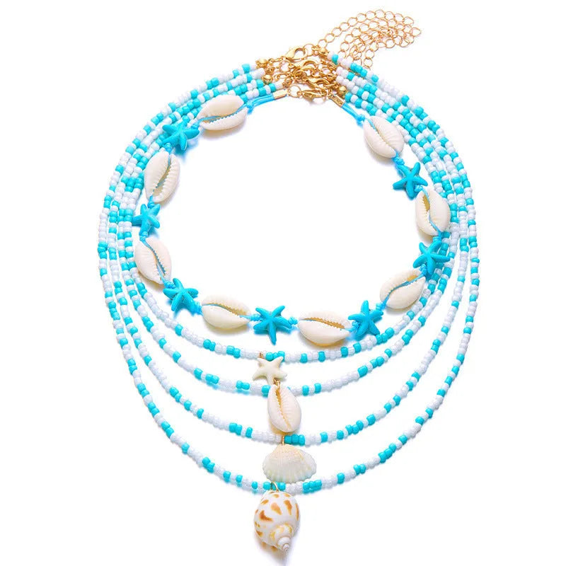 Women's multi-layer necklace set with starfish and shell bead pendants on adjustable chain