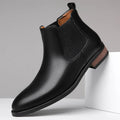 Men's black pointed-toe Chelsea ankle boot with a high-top silhouette and rubber sole.