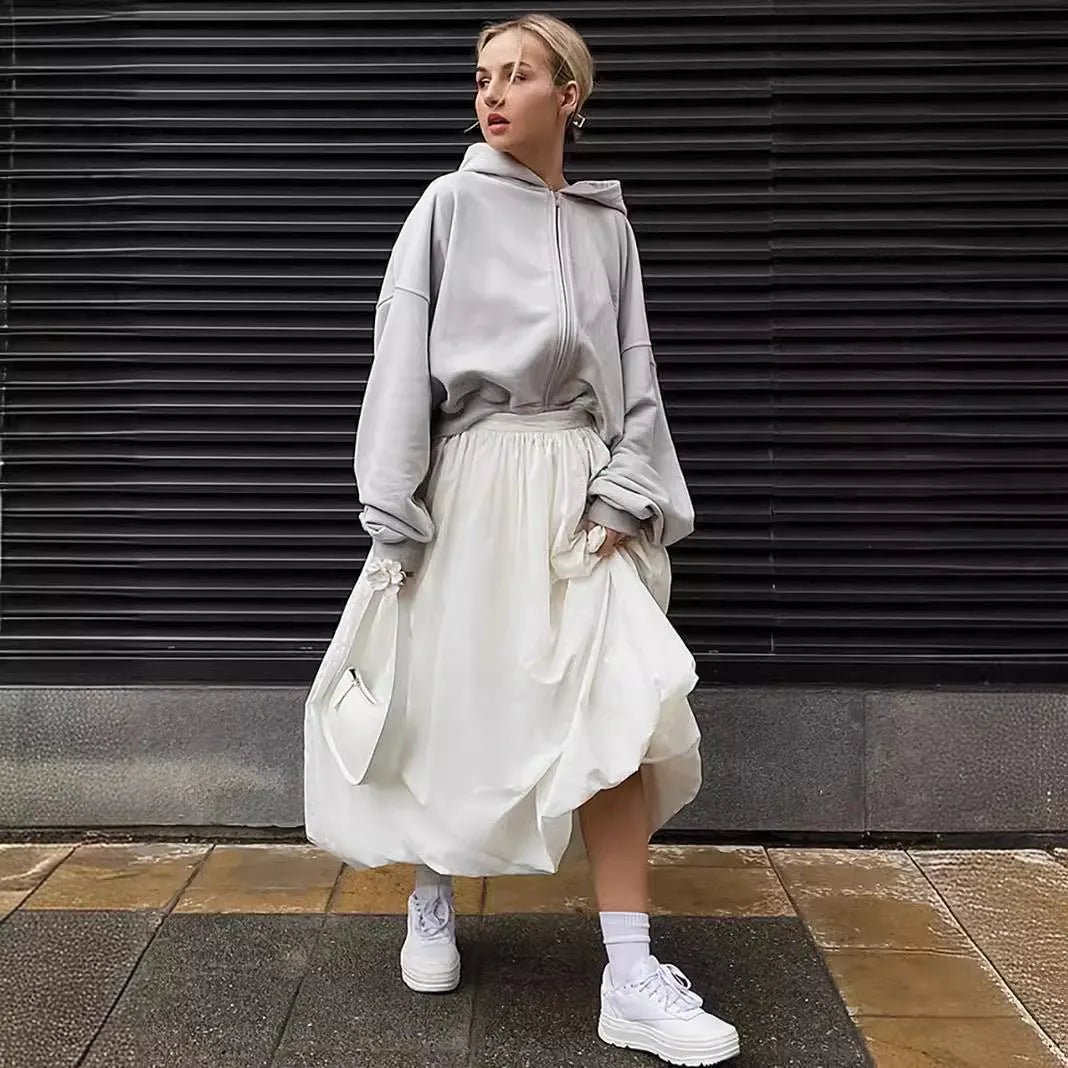 Women's solid colour long cotton skirt in black, shown with a structured fit suitable for casual or commute wear.