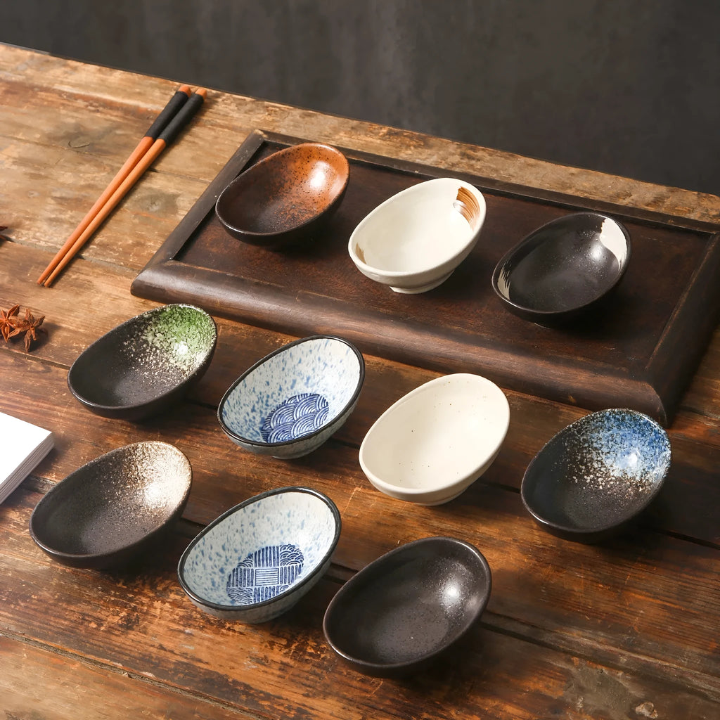 Japanese ceramic oval sauce dipping bowl with decorative glaze pattern