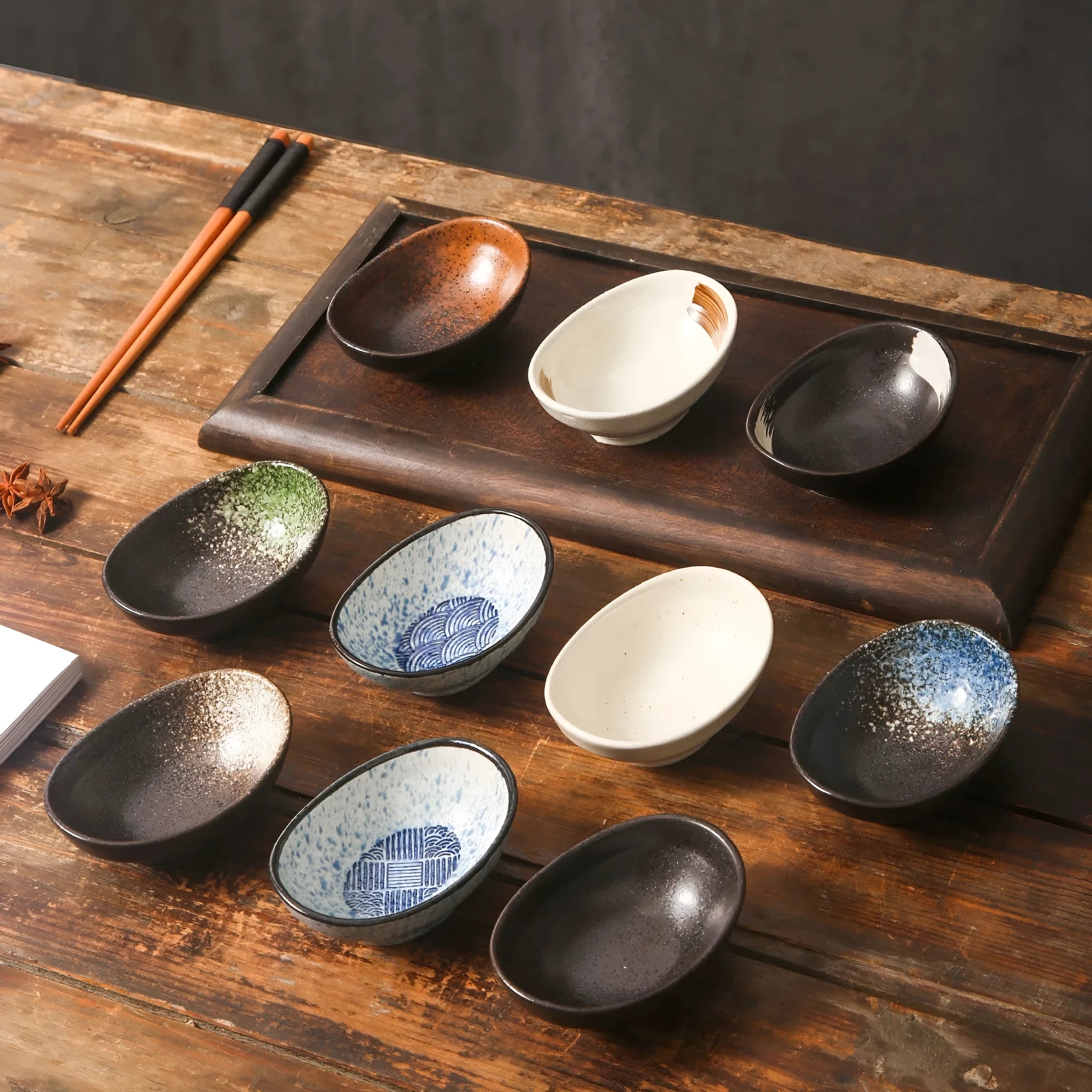 Japanese ceramic oval sauce dipping bowl with decorative glaze pattern