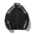 Men's black and dark blue colour block casual jacket with contrast stitching and side pockets.
