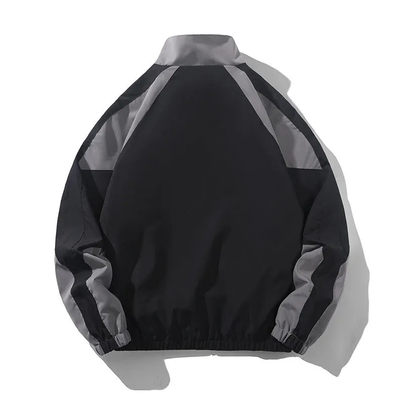 Men's black and dark blue colour block casual jacket with contrast stitching and side pockets.