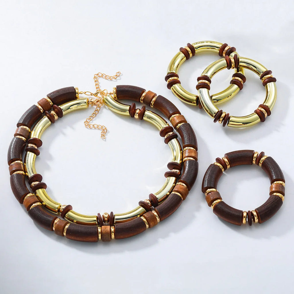 Women's layered alloy necklace and bracelet set with round pendants and regular chain design