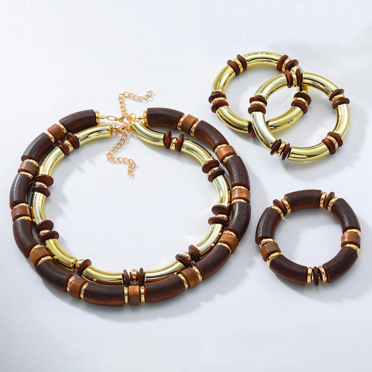 Women's layered alloy necklace and bracelet set with round pendants and regular chain design