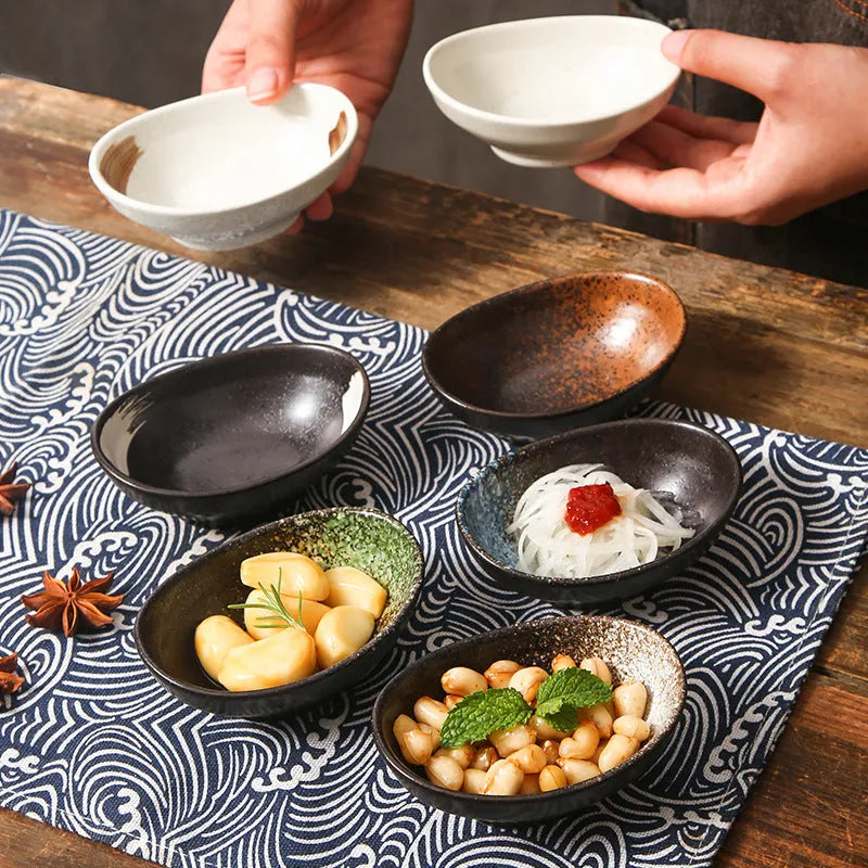 Japanese ceramic oval sauce dipping bowl with decorative glaze pattern