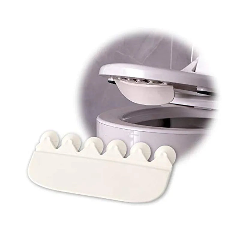 White PVC urine blocking board for children's toilet training placed around toilet bowl